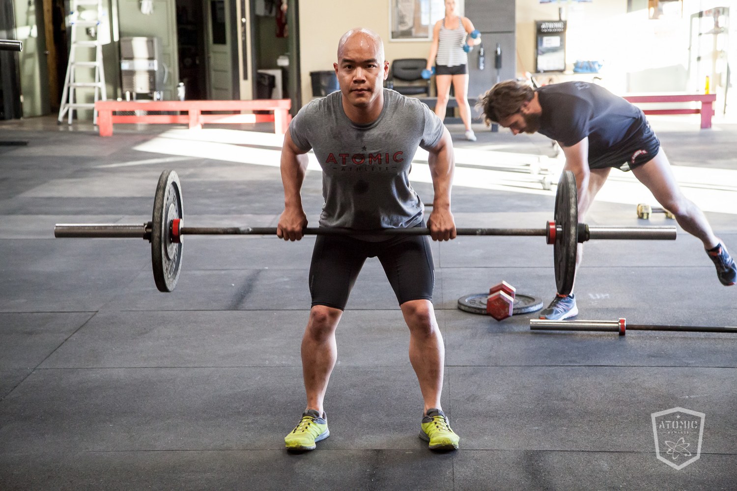 An athlete pulling a heavy barbell deadlift, building the raw strength to break grips and control position