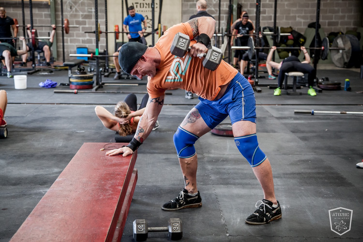 An athlete driving an explosive kettlebell swing, the hip power that fuels a guard pass or a sweep