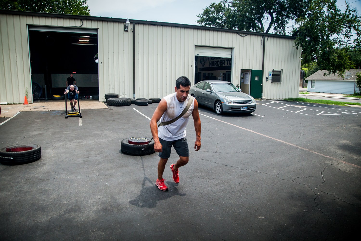 An athlete sprint-dragging a loaded sled, building the work capacity a scramble runs on